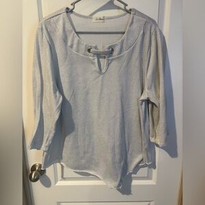 Le Rogue 1X silver glitter top with raw hem and cutout neckline. 3/4 sleeves.